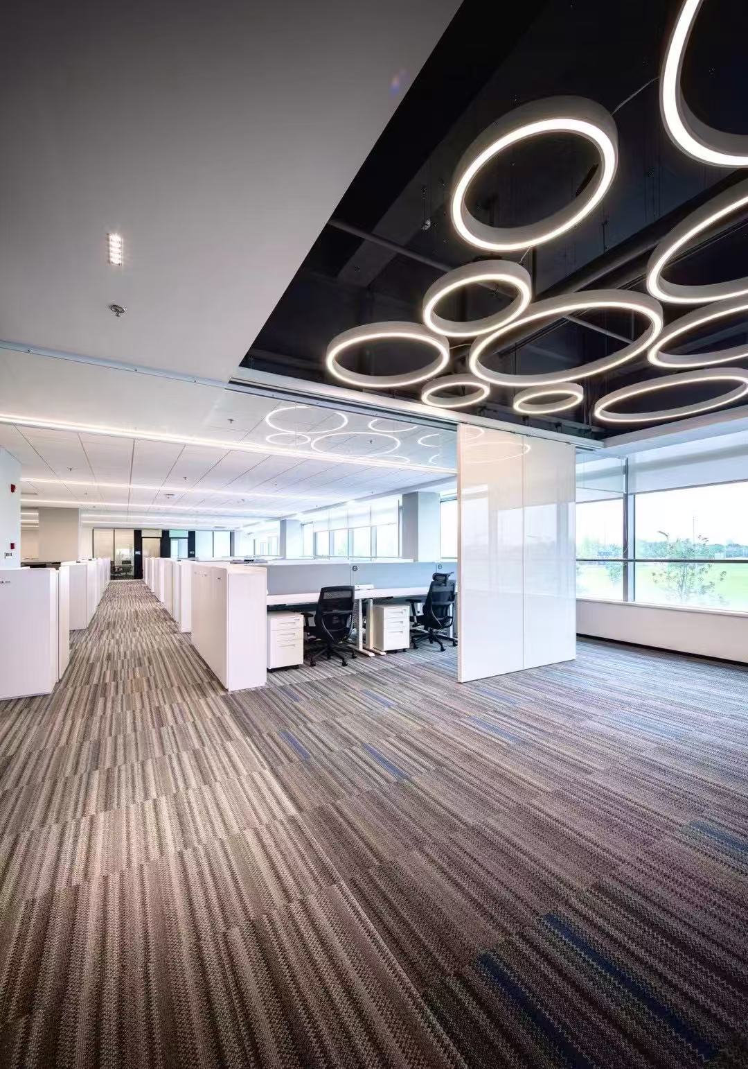 Completed industrial office with modern lighting and open work areas